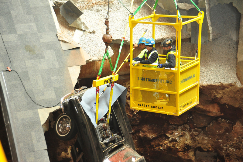 Illustration for article titled Check Out These Amazing Photos From The Corvette Sinkhole Recovery